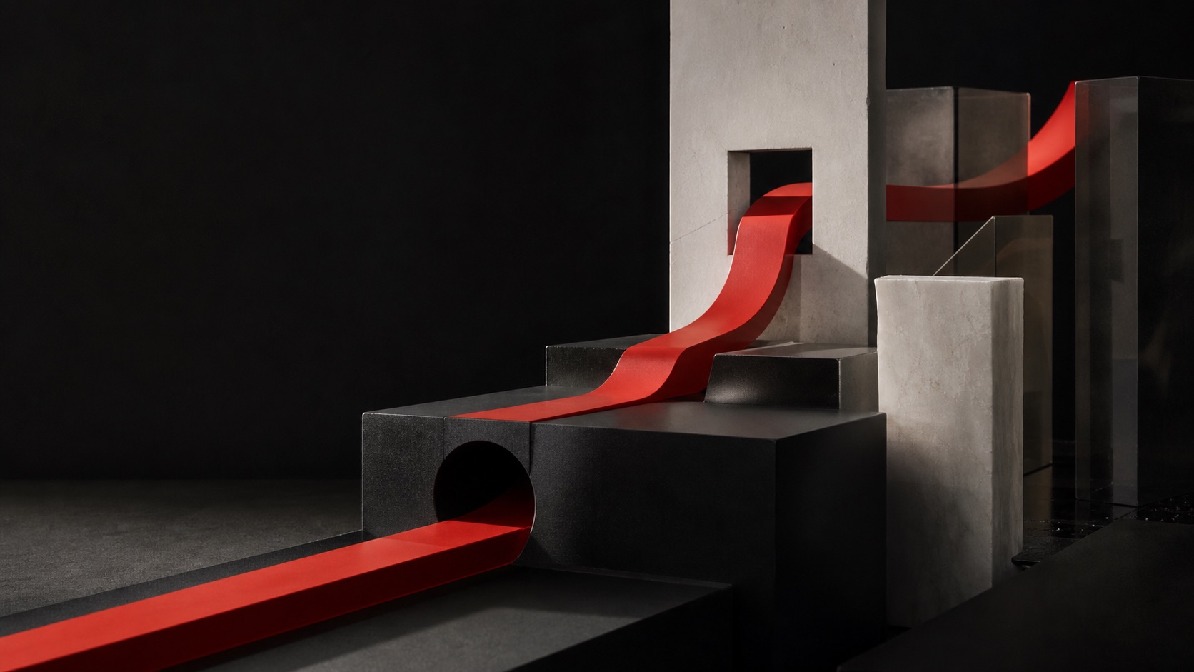 A continuous red structural ribbon passes through black metal, pale mineral, and smoked glass forms.